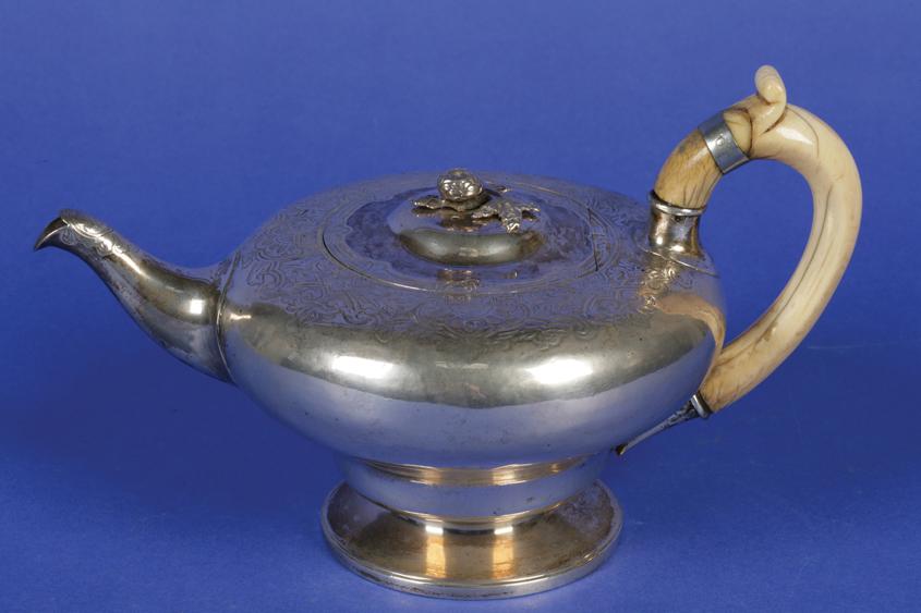 Appraisal: A WILLIAM IV TEAPOT of compressed circular form the flush-hinged