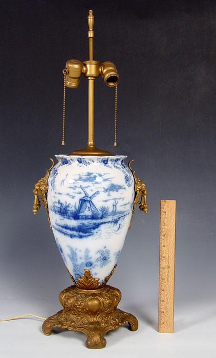 Appraisal: FINE PORCELAIN LAMP Cobalt decorated Dutch landscape metal masqueron mounts