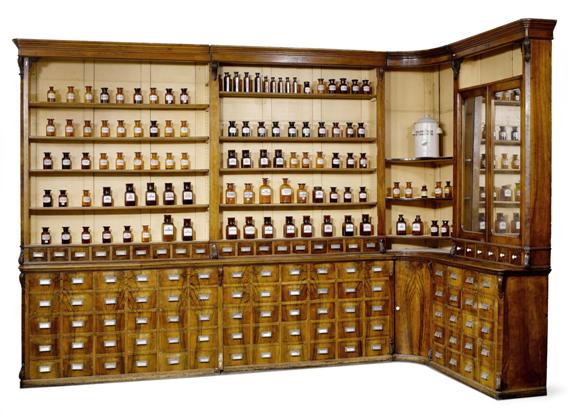 Appraisal: LARGE PHARMACIST'S CABINET from Rosenapotheke Winterthur circa Carved walnut Three