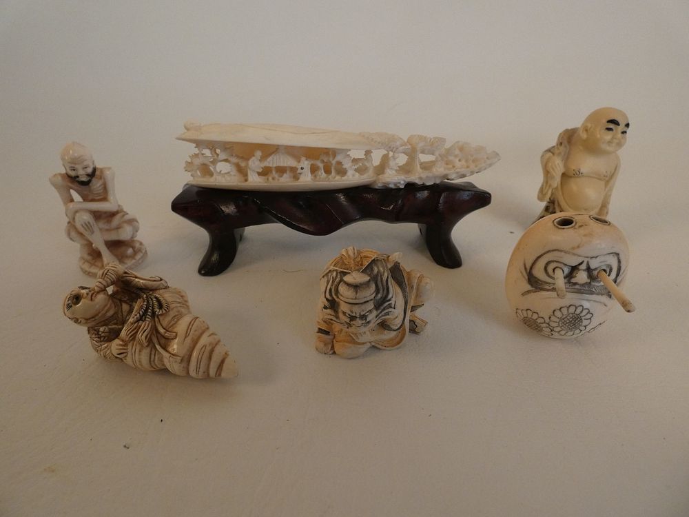 Appraisal: JAPANESE NETSUKES Lot assorted old Japanese carved netsukes to inch