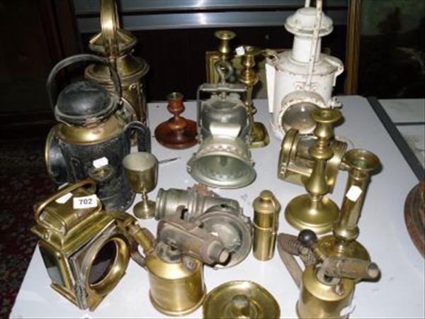 Appraisal: A collection of various brass lamps candlesticks blow torches some