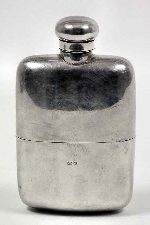 Appraisal: A silvery metal rectangular spirit flask with curved body and