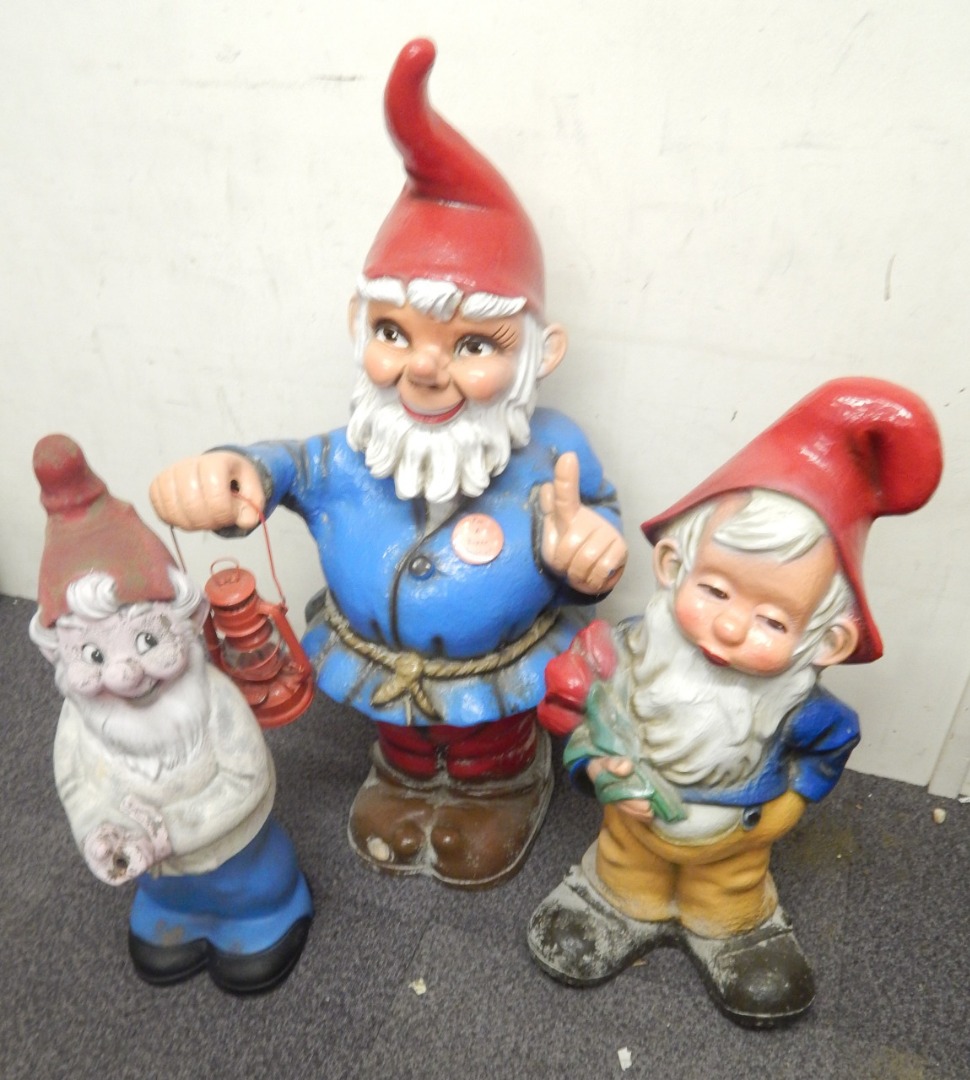 Appraisal: Three large painted plastic garden gnomes to include one described