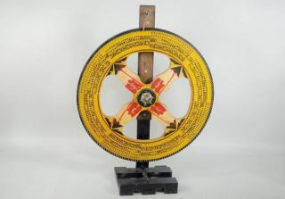 Appraisal: Folk Art Gaming Wheel With Paint Decoration Folk art gaming