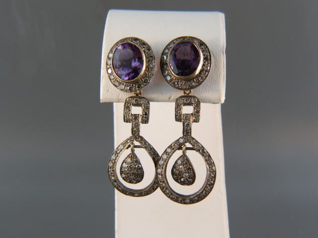 Appraisal: Amethyst Diamond Earrings oval gems totaling over carats diamonds throughout