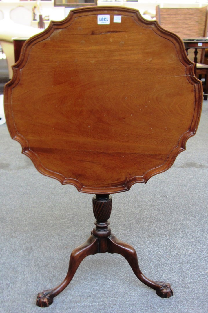 Appraisal: A th century mahogany pie crust snap top occasional table