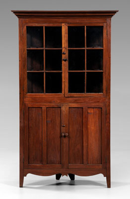 Appraisal: Southern walnut corner cupboard single-case construction yellow pine secondary glazed