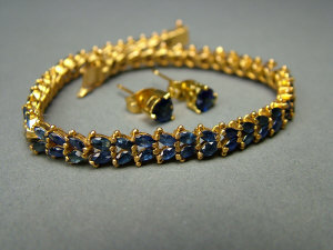 Appraisal: An Indian gold and sapphire double row bracelet of articulated