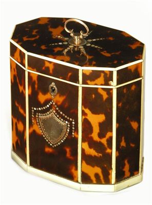 Appraisal: A George III tortoiseshell and ivory strung decagonal tea caddy