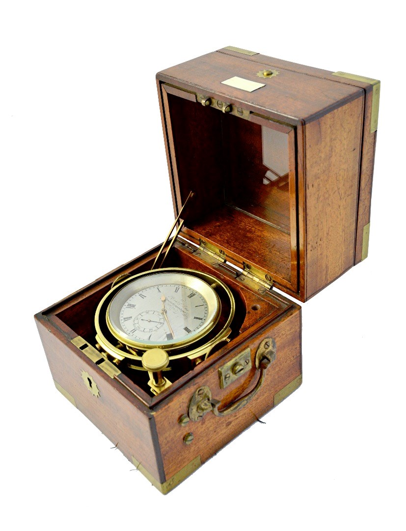 Appraisal: An early th century mahogany cased marine chronometer by Reid