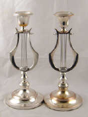 Appraisal: A pair of old Sheffield plate lyre shaped candlesticks with