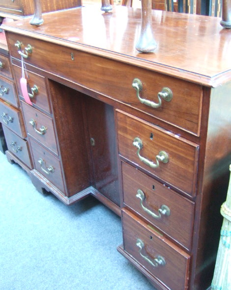 Appraisal: A th century mahogany kneehole desk of Queen Anne design