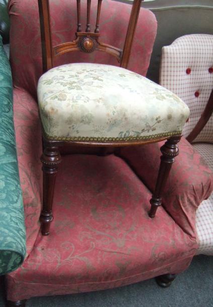 Appraisal: A Victorian mahogany framed armchair with outswept arms and bow