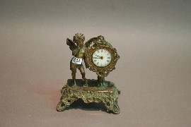 Appraisal: A cast metal art noveaux clock with putti