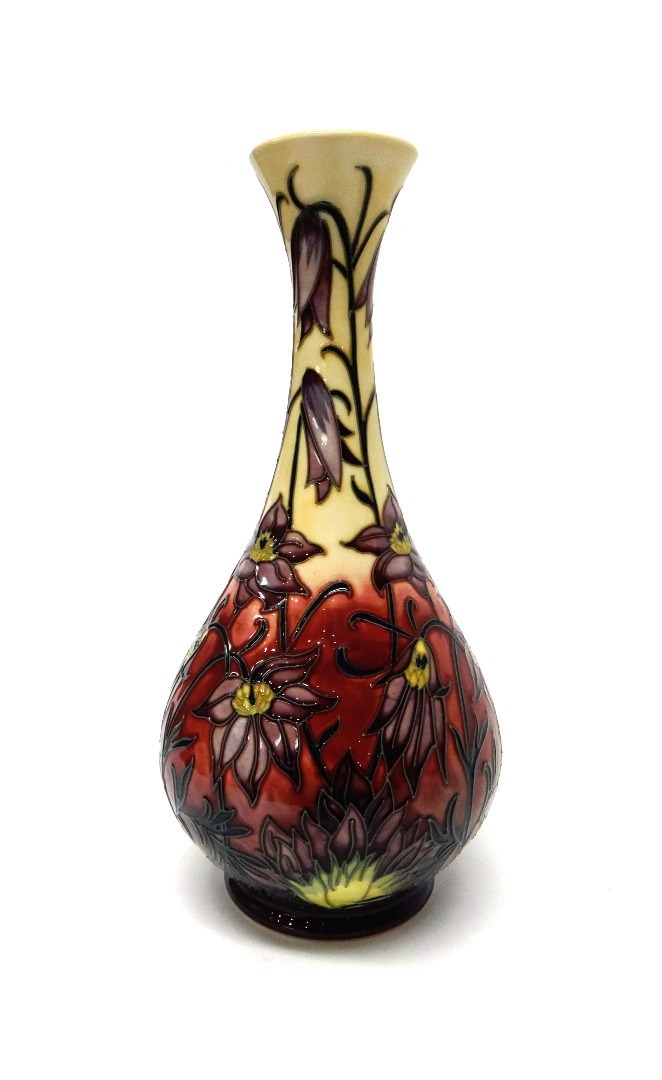 Appraisal: A Moorcroft 'Pascoe Flower' cream ground vase by Philip Gibson