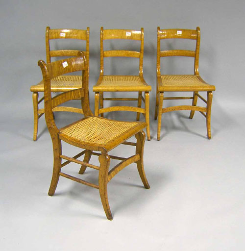 Appraisal: Set of figured maple saber leg chairs th c