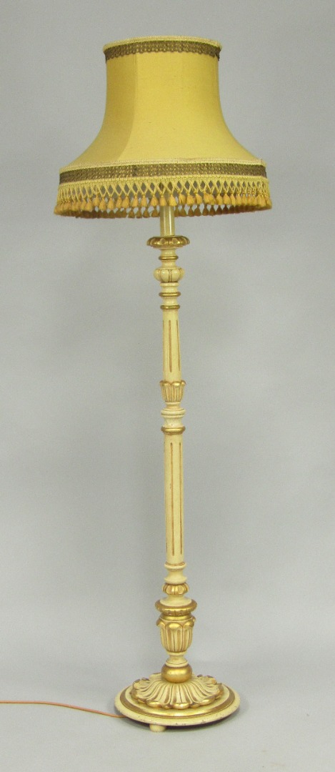 Appraisal: A cream and gilt painted fluted and lappet carved standard