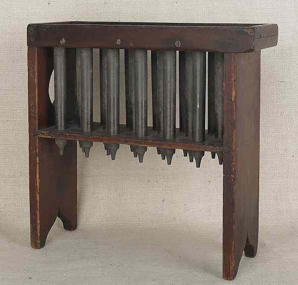 Appraisal: Pennsylvania pine candlemold th c with eighteen pewter tubes h