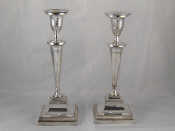 Appraisal: A pair of Georgian Sheffield plate candlesticks the tapering columns