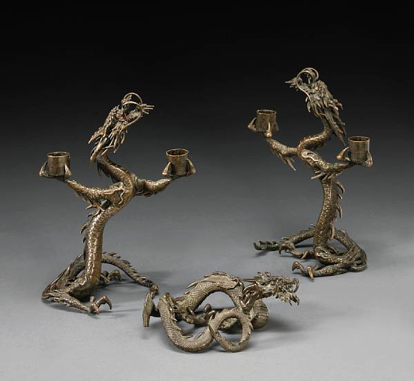 Appraisal: A pair of silvered bronze candle stands Meiji Period Cast