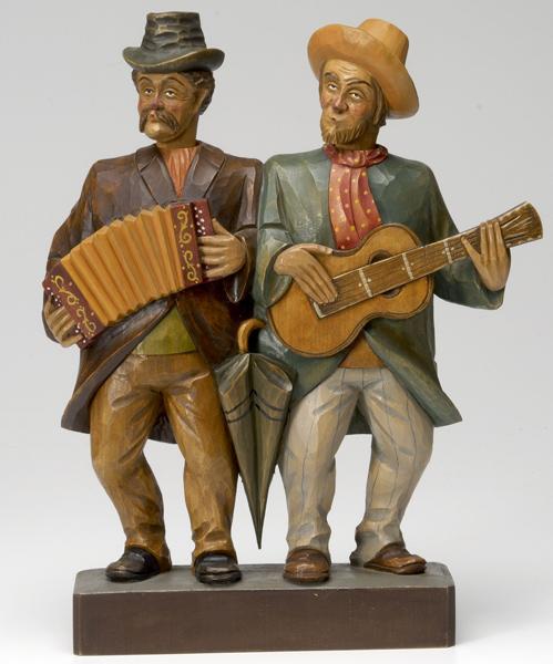 Appraisal: GERMAN FOLK ART German hand-carved wooden Whistlers of two musicians