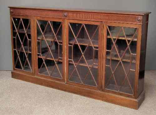 Appraisal: A mahogany dwarf bookcase of Georgian design with fluted frieze