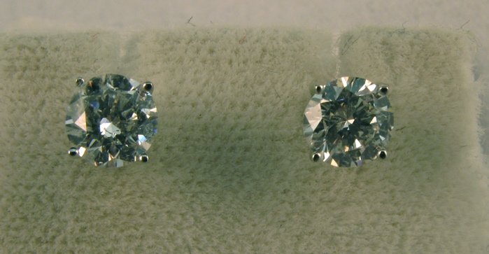 Appraisal: PAIR OF DIAMOND AND FOURTEEN KARAT WHITE GOLD EAR STUDS