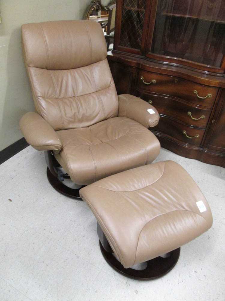 Appraisal: MODERN LEATHER RECLINING LOUNGE CHAIR WITH MATCHING FOOTSTOOL Ekornes retro