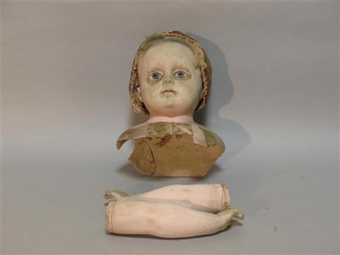 Appraisal: CONTINENTAL LARGE TINTED PLASTER DOLL'S HEAD AND ARMS The expressive