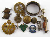 Appraisal: A quantity of military cap and other badges buttons etc