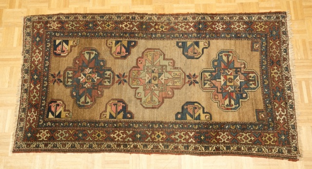 Appraisal: Semi-Antique Carpet Brown field with blue and pink center medallions