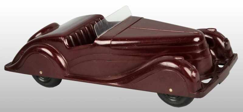 Appraisal: Bakelite Toy Automobile Description American Marked Kodeg on back license