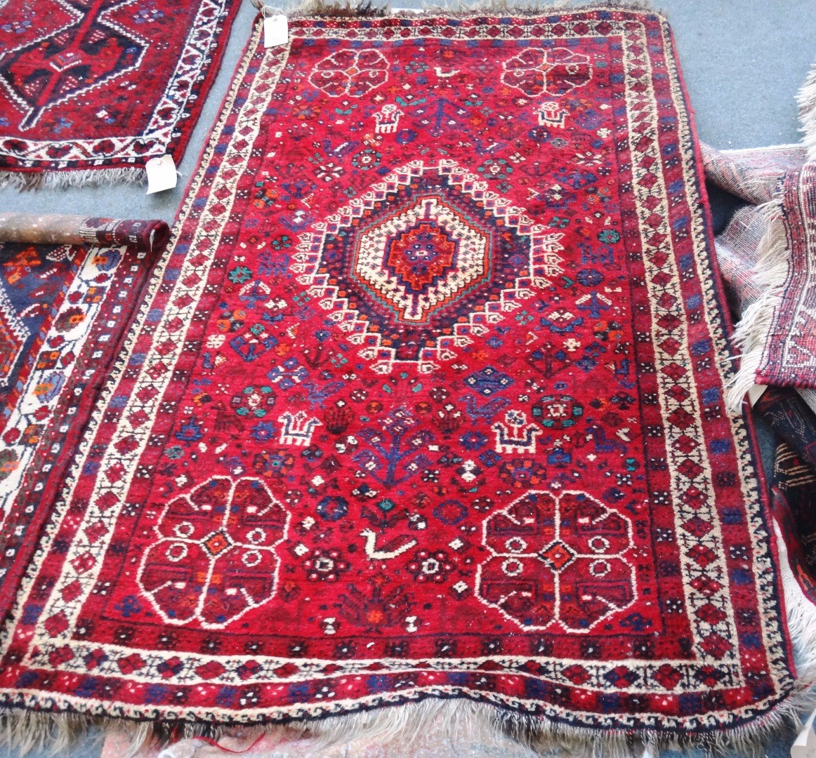 Appraisal: A Shiraz rug South Persian the madder field with a