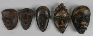 Appraisal: African passport masks African passport masks carved wood '' largest