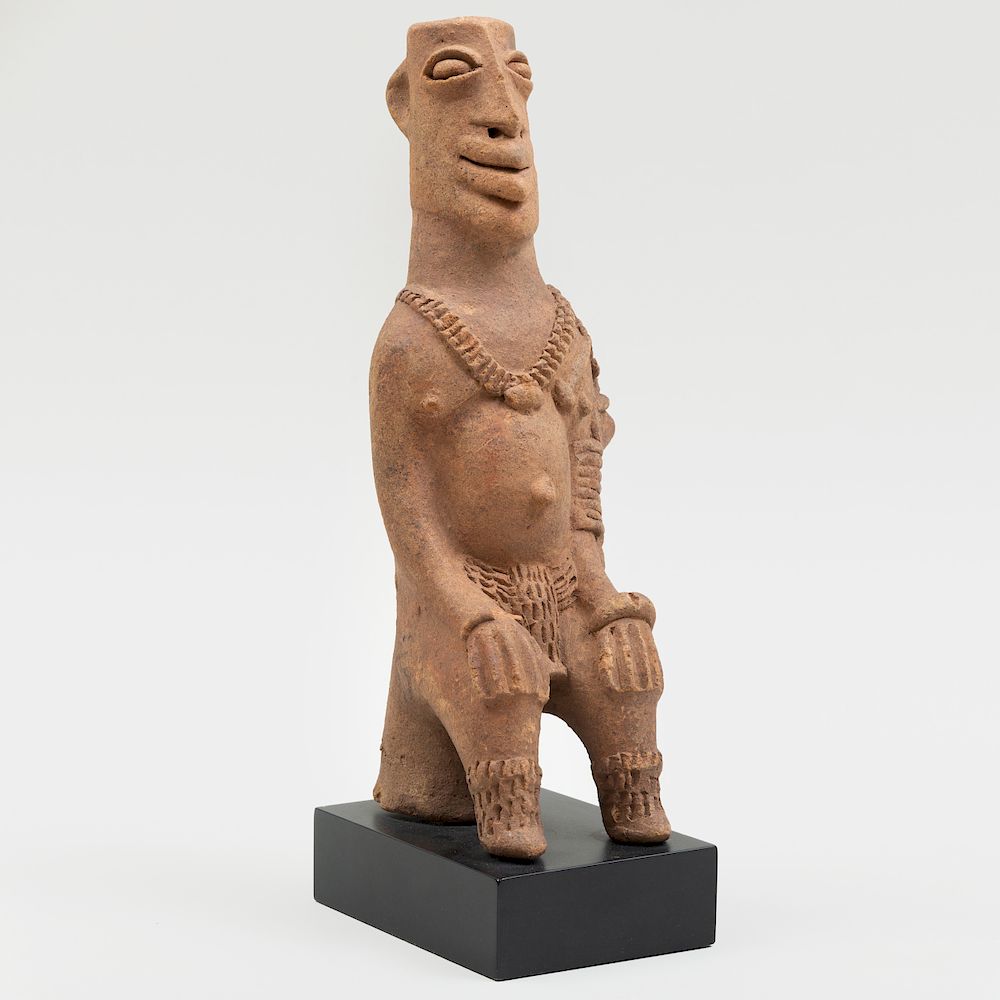 Appraisal: Koma Builsa Seated Terracotta Figure Ghana Now raised on a