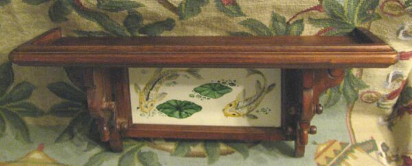 Appraisal: KOI FISH TILE BACKED WALL SHELF