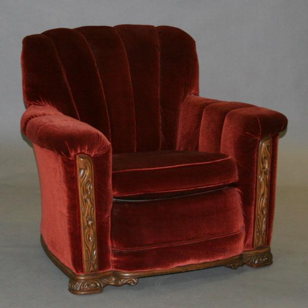 Appraisal: Upholstered chair tufted overstuffed Deco styling rolled back carved wood