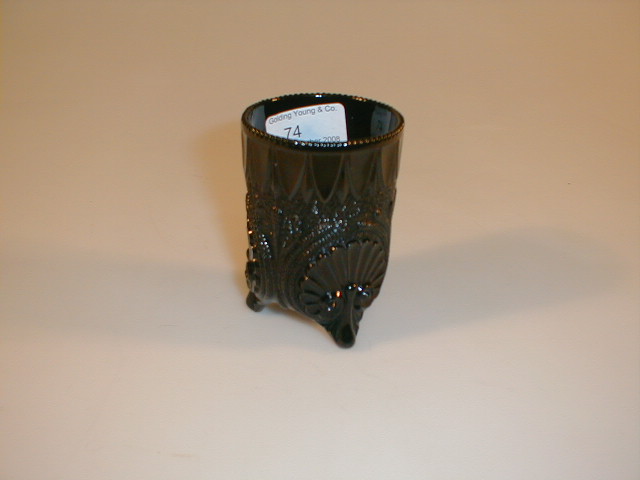 Appraisal: A black pressed glass tumbler