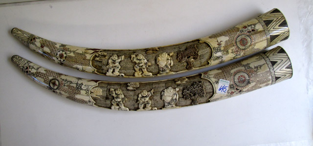 Appraisal: PAIR OF CHINESE CARVED BONE TUSKS scrimshawed and with figural