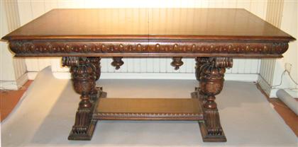 Appraisal: Carved oak library table The rectangular top raised on baluster