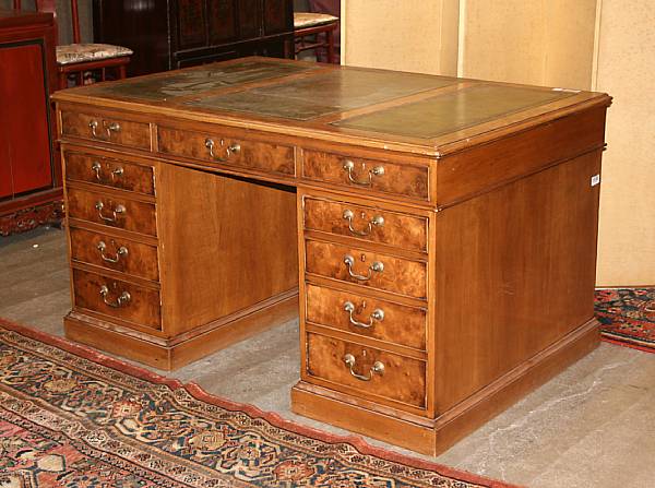 Appraisal: A George III style walnut kneehole desk first half th