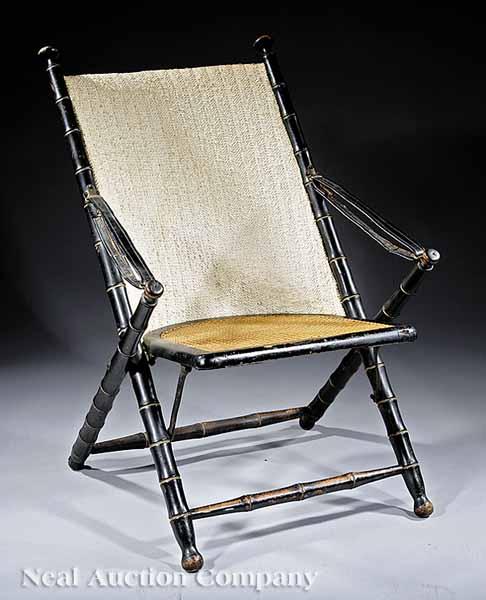 Appraisal: An American Ebonized Folding Campaign Chair c gilt incised faux