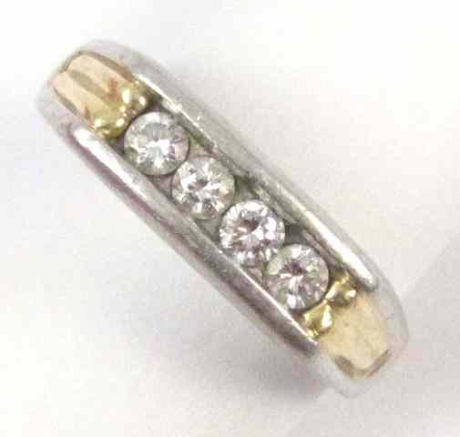 Appraisal: MAN'S DIAMOND PLATINUM AND FOURTEEN KARAT GOLD RING set with