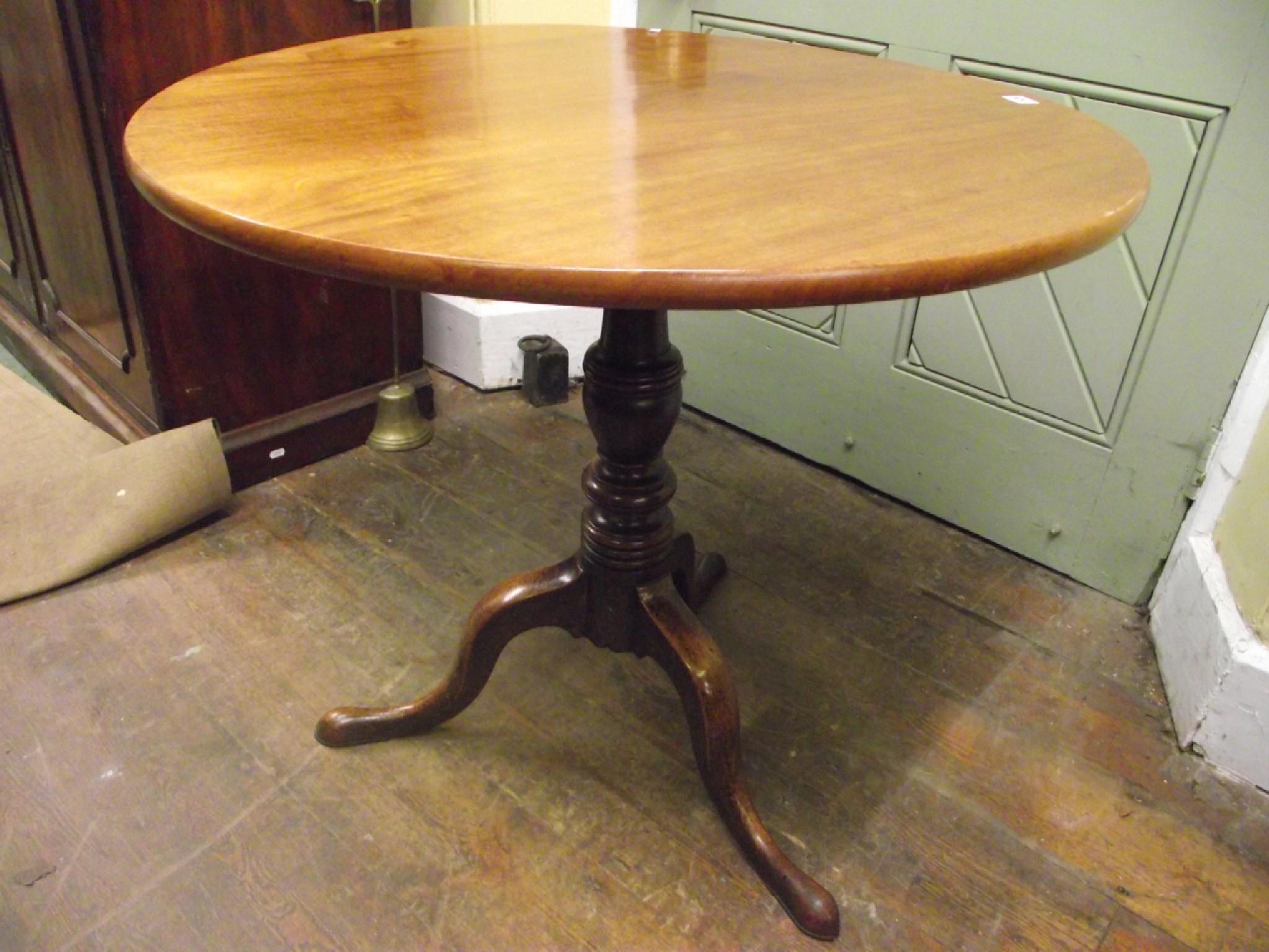 Appraisal: A th century mahogany snap top occasional table on turned