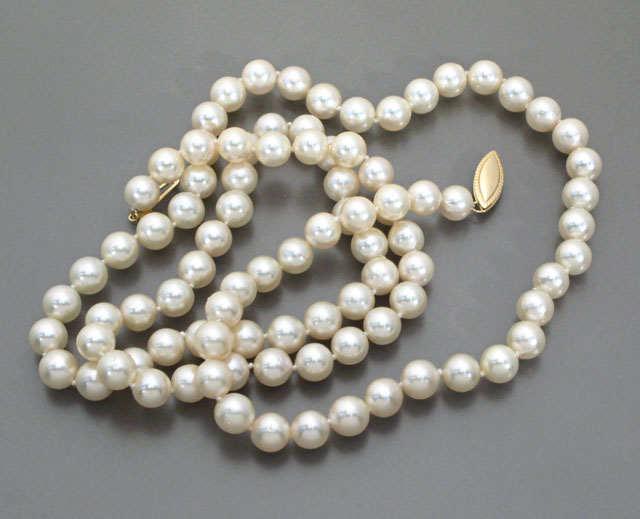 Appraisal: OPERA LENGTH PEARL NECKLACE strung with round white pearls -