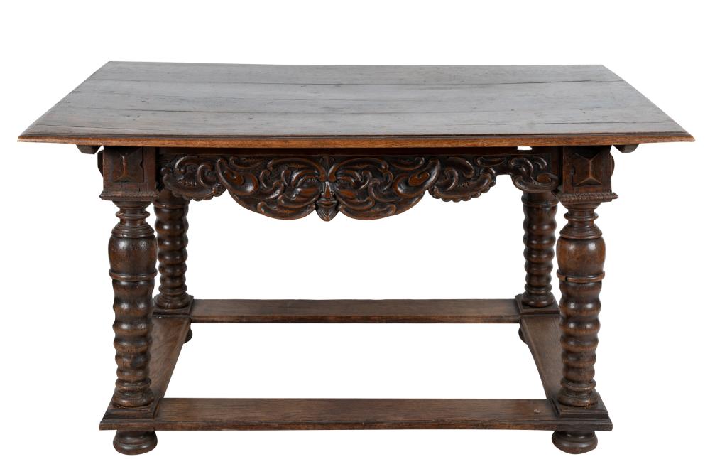 Appraisal: CARVED WALNUT LIBRARY TABLEthe aprons on each side carved with