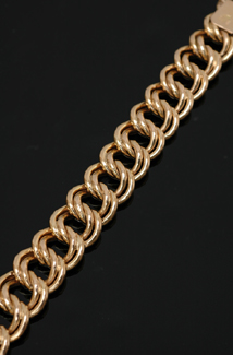 Appraisal: A gold curblink bracelet Comprising fixed double curb links length