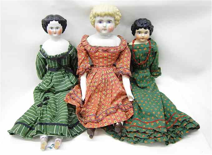 Appraisal: THREE TH CENTURY CHINA GLAZED PORCELAIN SHOULDER HEAD DOLLS with