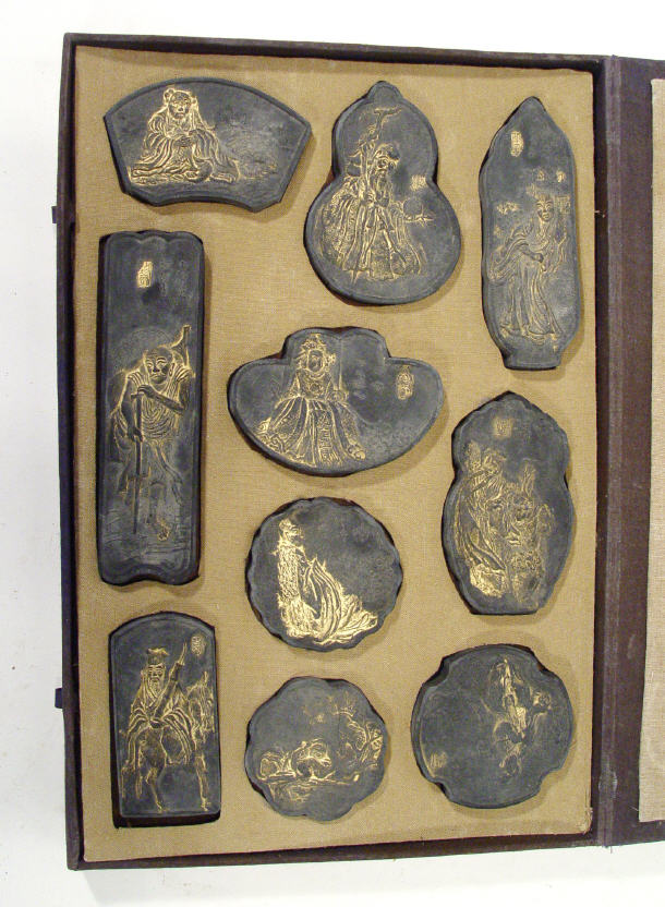 Appraisal: Cased set of ten oriental seals gilded with figures to