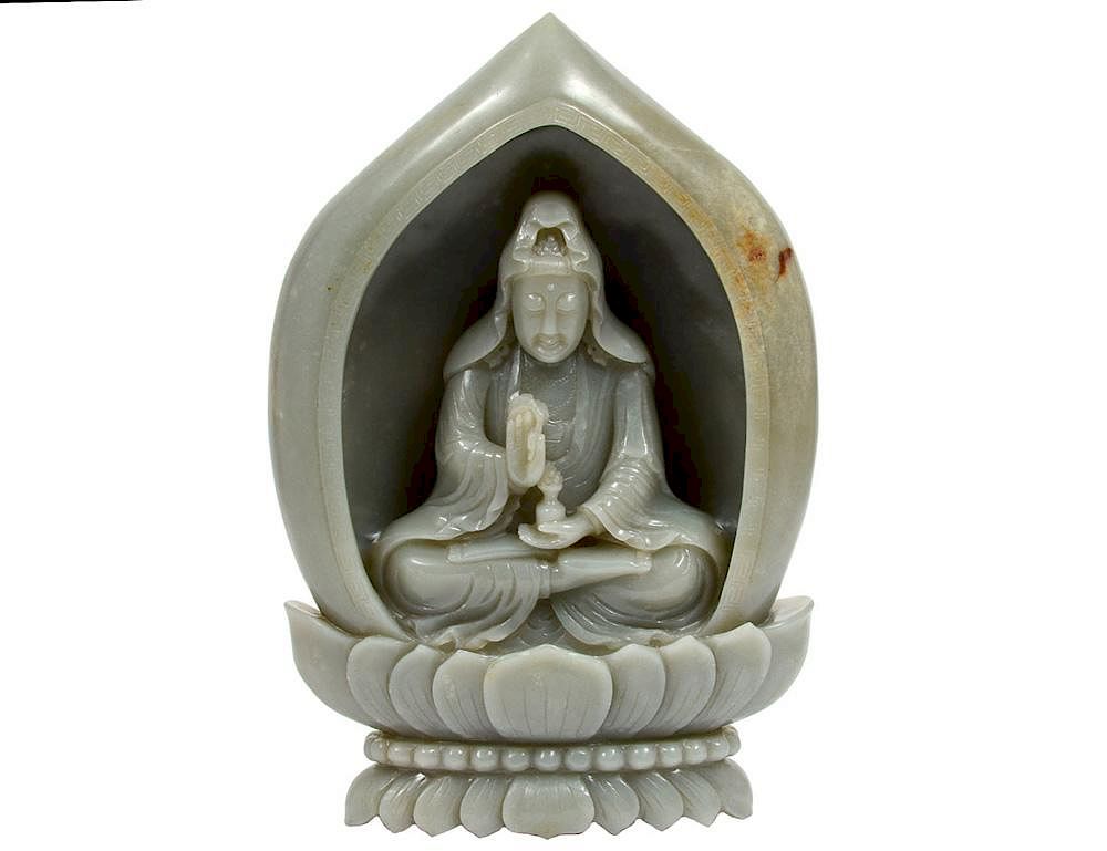 Appraisal: CARVED WHITE JADE BOULDER Chinese Depicting the goddess Guanyin seated